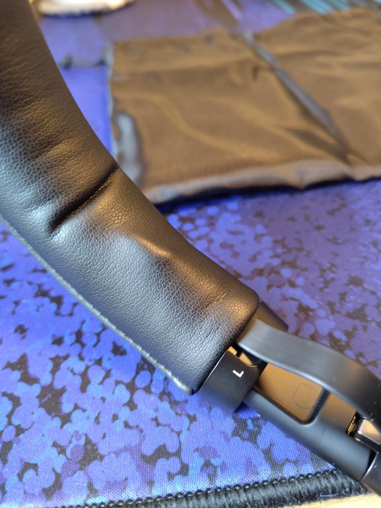 The USB-C cable being twisted inside the headphones.